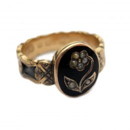 Victorian forget-me-not seed pearl and black enamel 9ct gold ring, the band fully engraved and enamelled
