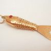 Very fine vintage 18ct gold articulated fish with red eyes