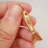 Very fine vintage 18ct gold articulated fish with red eyes
