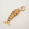 Articulated fish charm with a pearl set to mouth