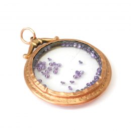 Victorian gold shake locket filled with amethyst crystals