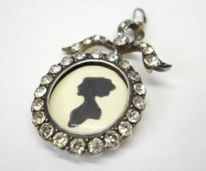 Antique sterling silver and paste bow locket, circa 1900-10