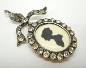 Antique sterling silver and paste bow locket, circa 1900-10