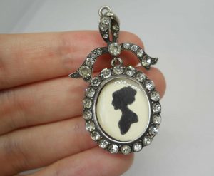 Antique sterling silver and paste bow locket, circa 1900-10