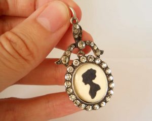 Antique sterling silver and paste bow locket, circa 1900-10