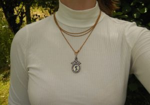 Antique sterling silver and paste bow locket, circa 1900-10