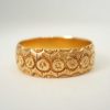 Antique Victorian floral motif embossed 18ct gold band
