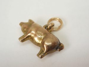 Antique puffy gold pig charm, circa 1910