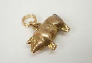 Antique puffy gold pig charm, circa 1910