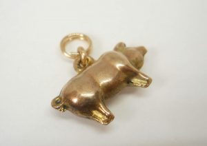 Antique puffy gold pig charm, circa 1910