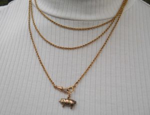 Antique puffy gold pig charm, circa 1910