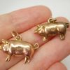 Antique puffy gold pig charms, circa 1900 and 1910