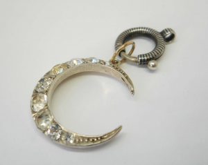 Antique silver paste crescent pendant on a niello bolt ring