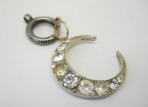 Antique silver paste crescent pendant on a niello bolt ring