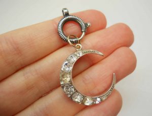 Antique silver paste crescent pendant on a niello bolt ring