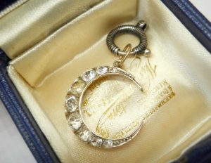 Antique silver paste crescent pendant on a niello bolt ring