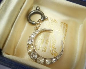 Antique silver paste crescent pendant on a niello bolt ring
