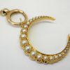 Victorian 15ct gold seed pearl crescent pendant on a 9ct gold bolt ring, both circa 1890