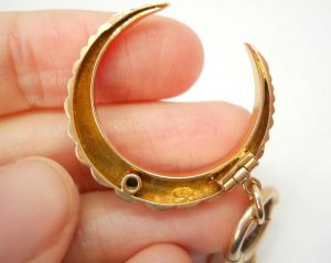Victorian 15ct gold seed pearl crescent pendant on a 9ct gold bolt ring, both circa 1890