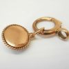 Victorian star set garnet 9ct gold charm on a 9ct gold bolt ring, both circa 1900